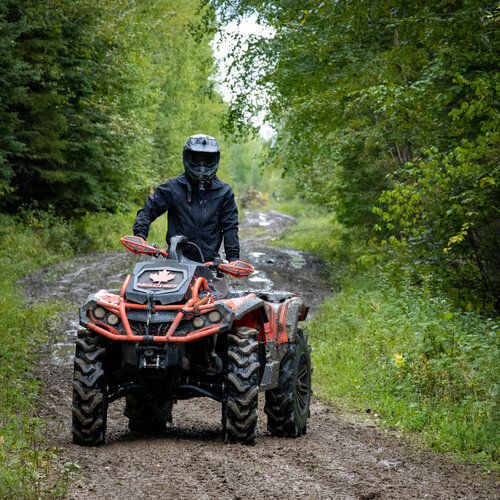 kyle riding his canam outlander on a trail